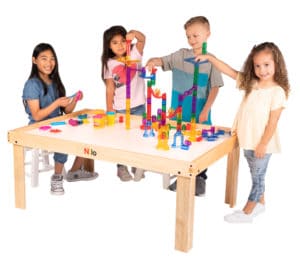 Four kids playing with marble run and plado on Nilo Large Childrens Play Table