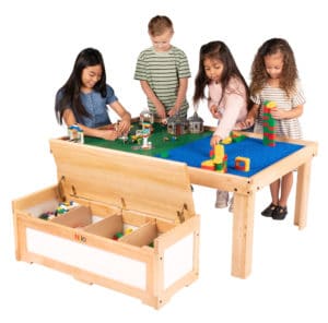 Four children playing with Lego and Duplo blocks on Large Nilo childrens play table and Nilo double-sided Lego Duplo compatible baseplates