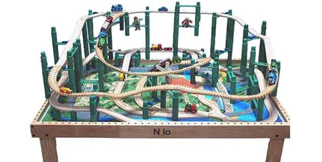 wooden train table with train track going off of the table, train table, train tables, wooden train table, train table wooden, kids train table, train table for adults