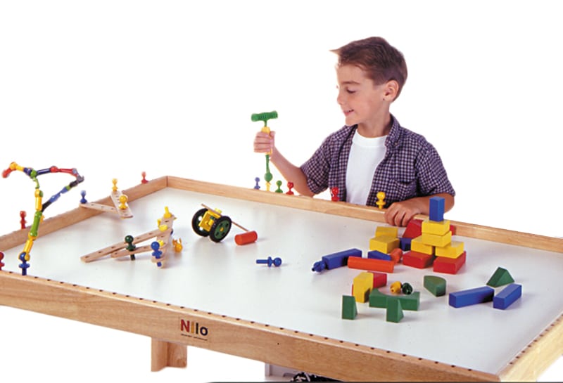 Zoob, wood blocks, and Nilo Nails shown being used on a Nilo childrens play table.