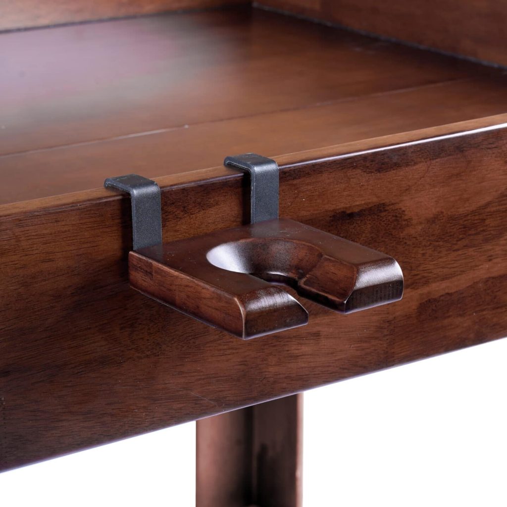 The Nilo wine glass holder shown on the Nilo Master table board game table in dark walnut stain.