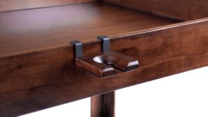 The Nilo wine glass holder shown on the Nilo Master table board game table in dark walnut stain.