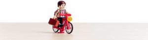 Adult Lego character biking towards the best lego table for adults