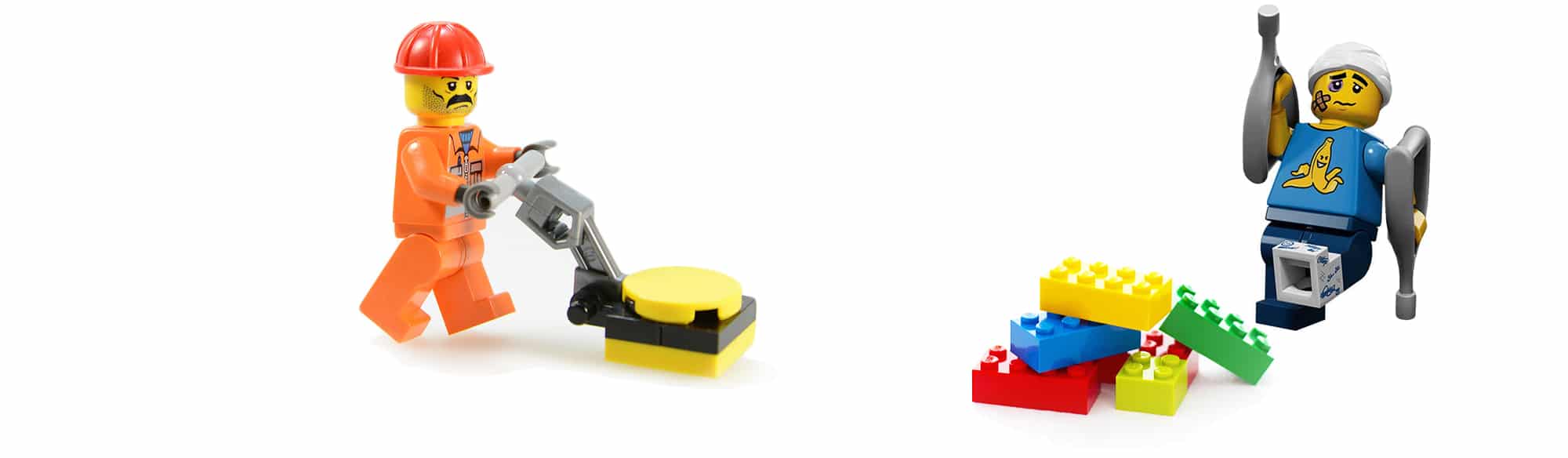 An injured adult Lego character that stepped onto Lego bricks and got injured. A Lego cleaner is going to pick the Lego bricks off of the ground for safety.